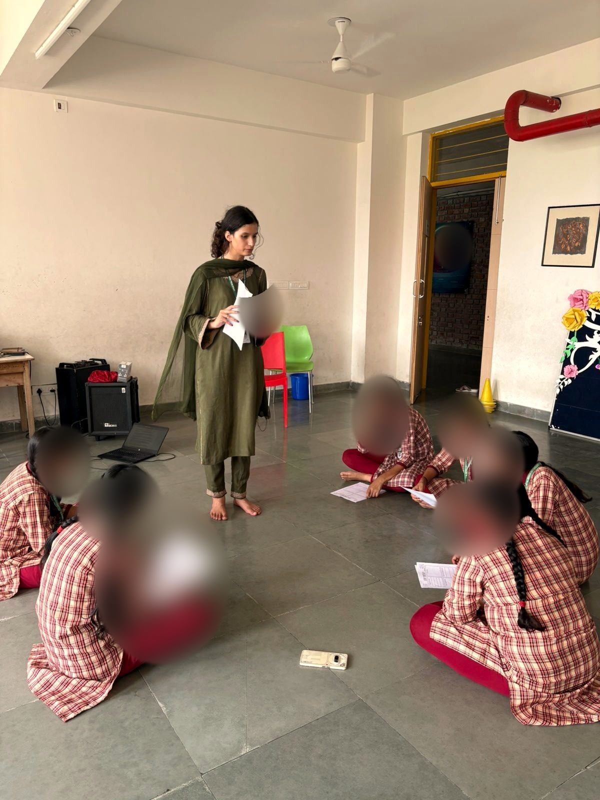 Small group workshop with school students, faces blurred for privacy