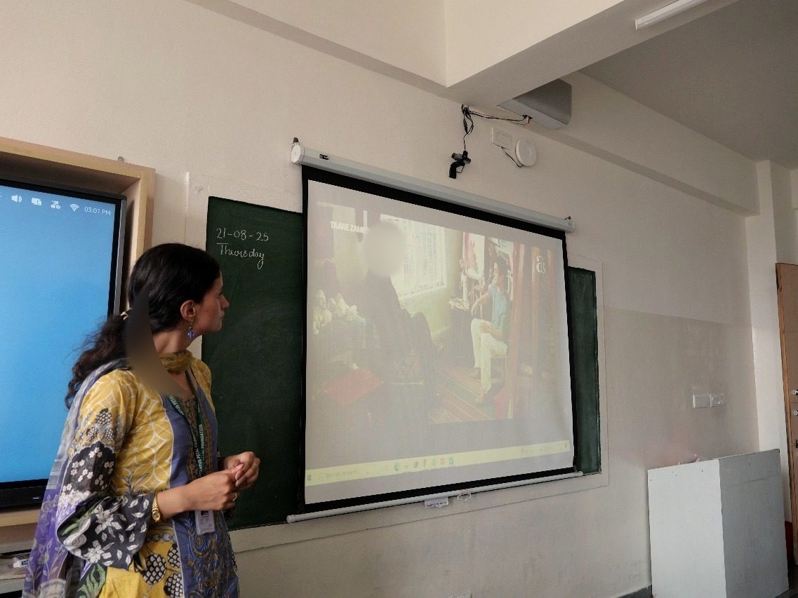 Tamana reviewing workshop material with students